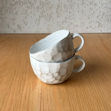 Load image into Gallery viewer, stack of two speckled cap cups showing facets and handles