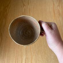 Load image into Gallery viewer, Top view of a handmade ceramic mug showing the faceted interior and rim

