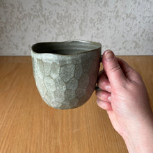 Load image into Gallery viewer, side view of large mug in hand showing facets and scale
