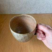 Load image into Gallery viewer, Side view of a wheel-thrown faceted mug, showing the rim and inside walls, BYRNT Ceramics
